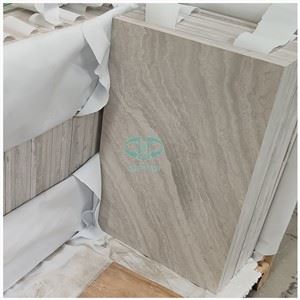 Rajoles de parquet i pis de marbre blanc